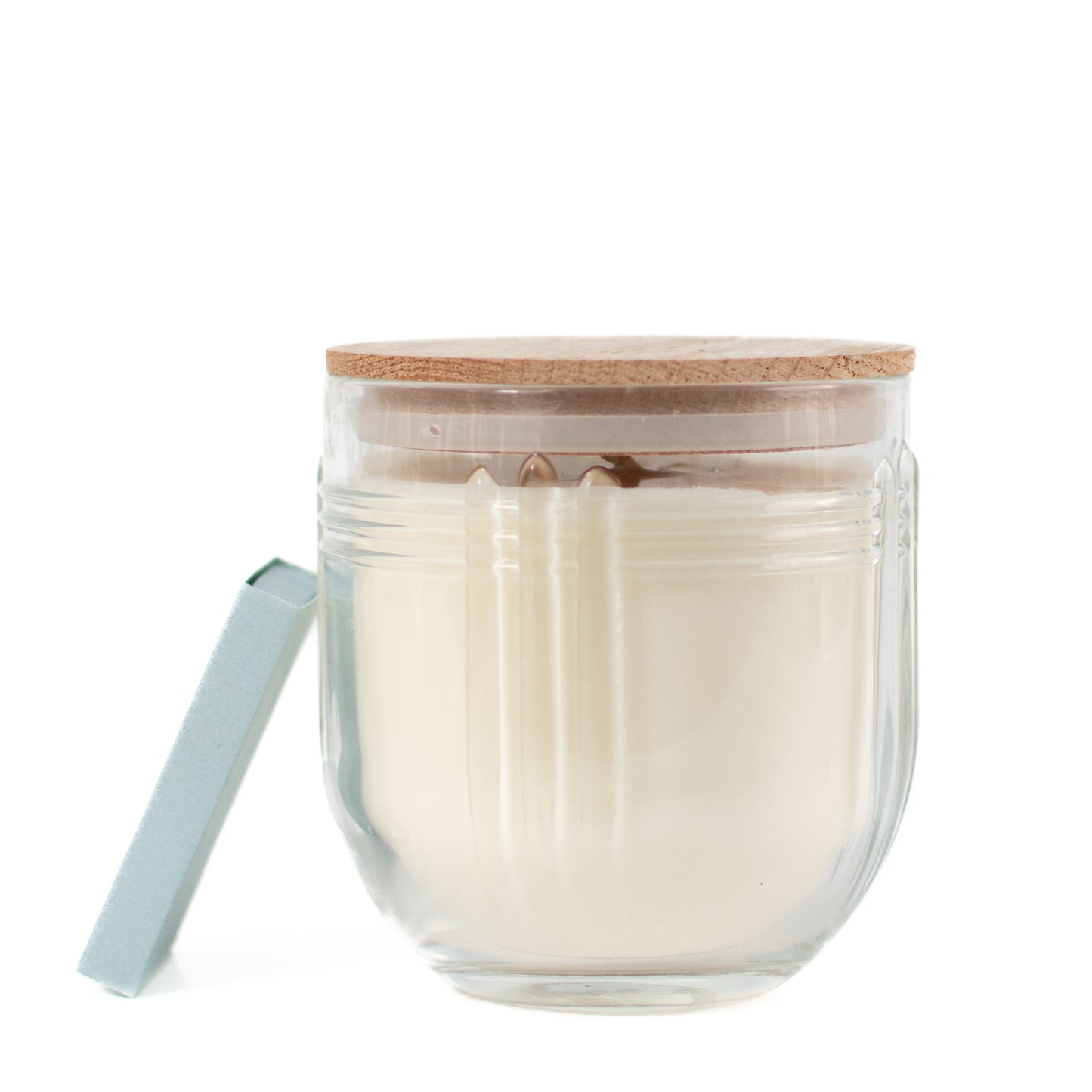 The Chicago fragrance free candle by Unscented Candle Company with matchbox on white background