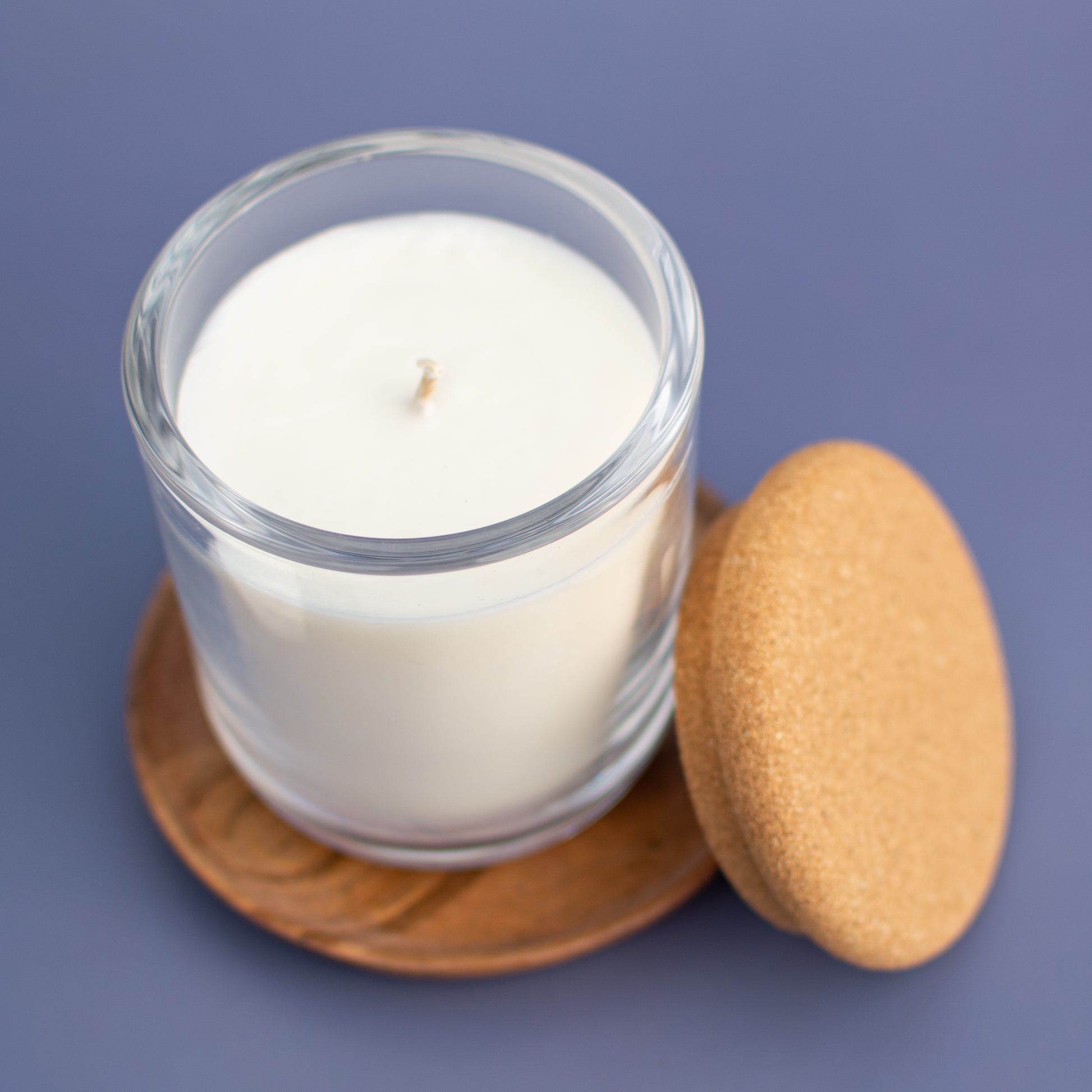 The Minneapolis fragrance free candle showing single wick, clear glass jar with natural cork lid by Unscented Candle Company