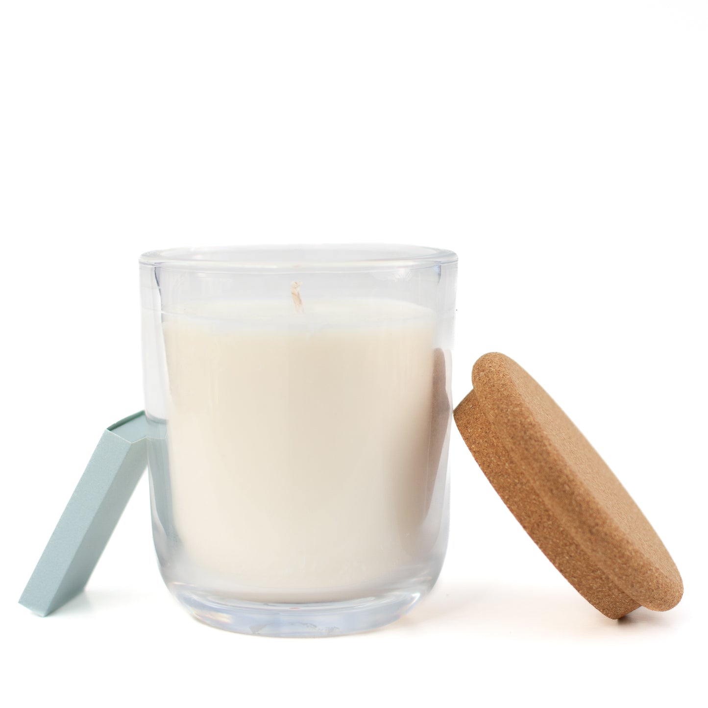 The Minneapolis soy candle on white background with matchbox by Unscented Candle Company
