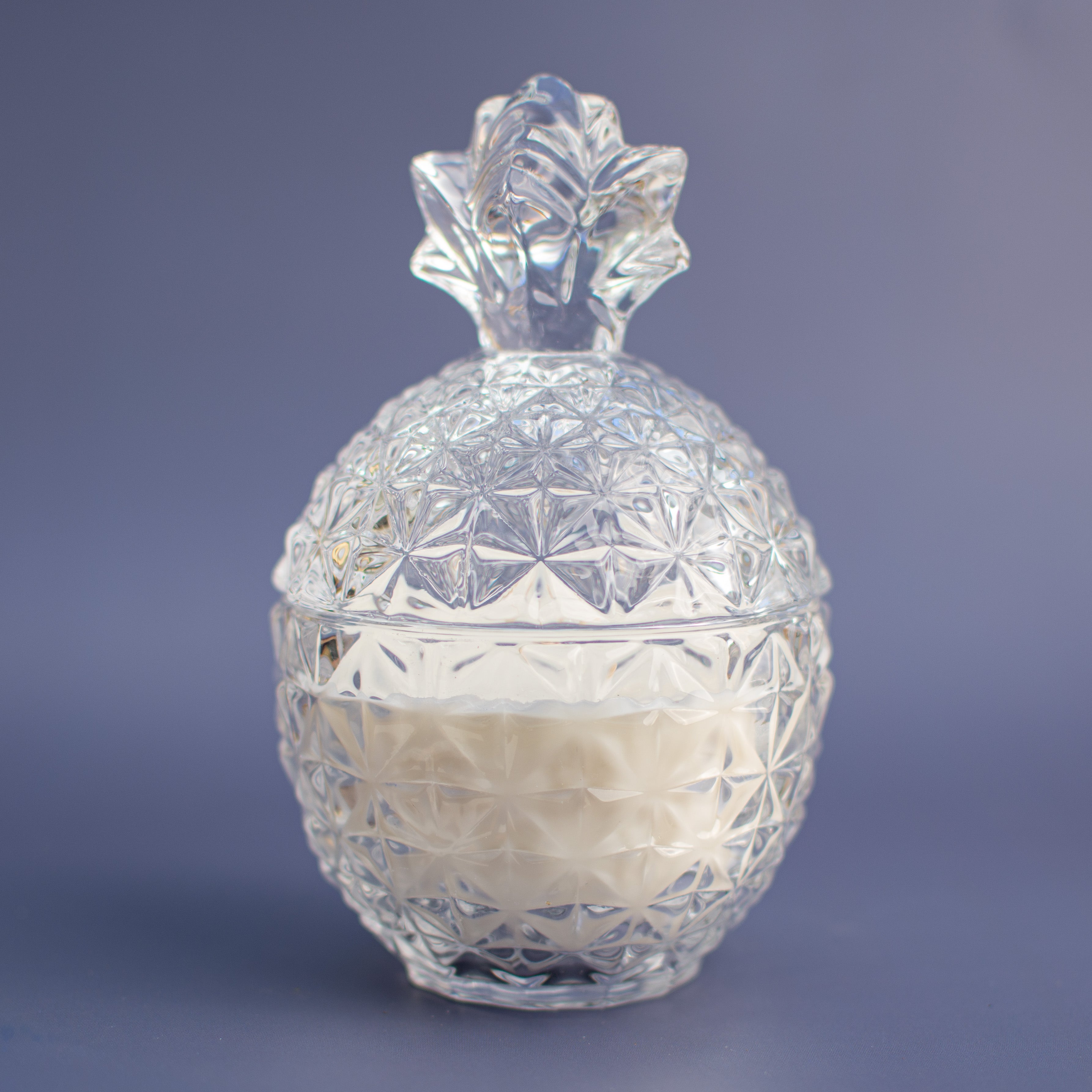 The Rio de Janeiro unscented candle in embossed pineapple glass vessel with lid by Unscented Candle Company