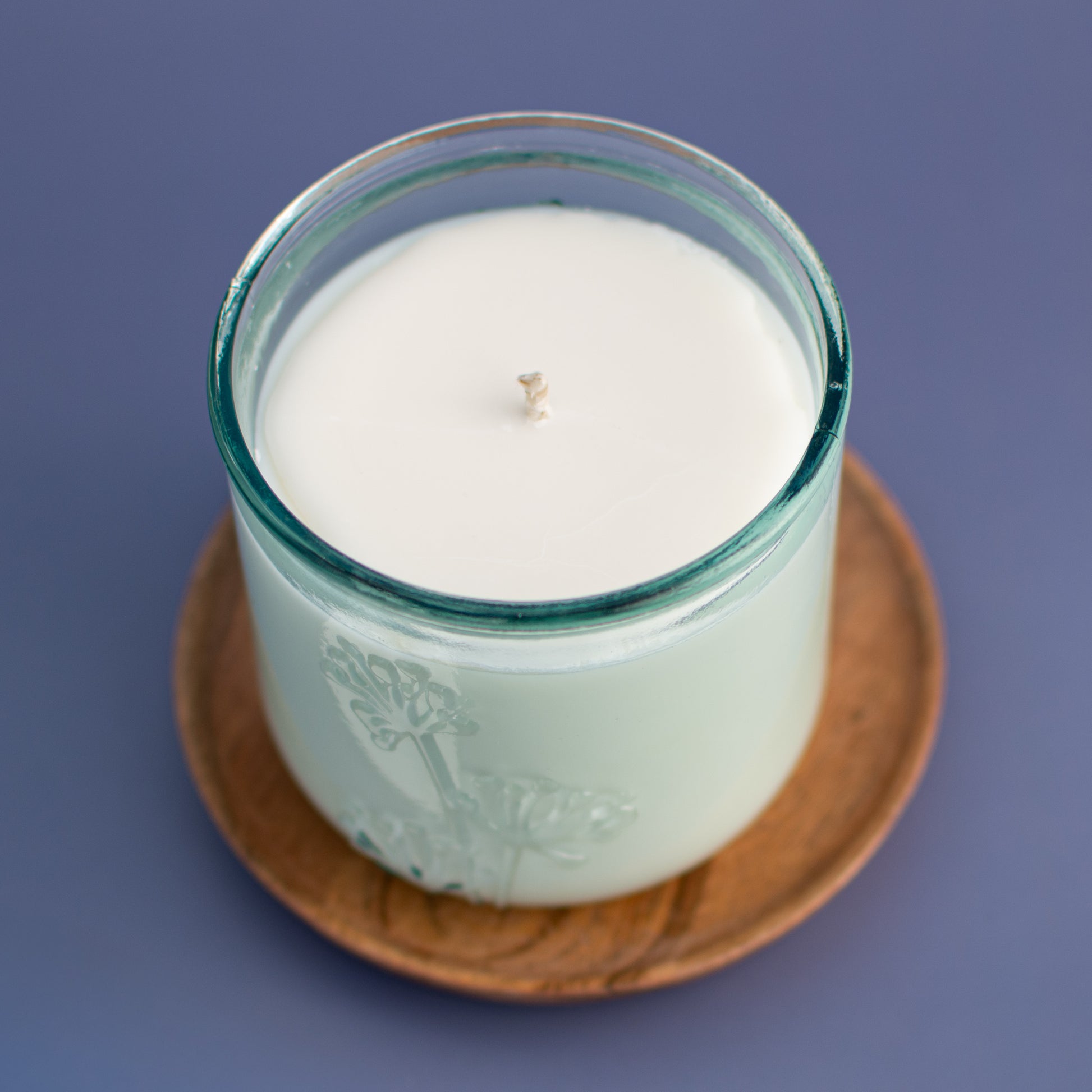 Overhead view of The Seville fragrance free candle in recycled glass vessel by Unscented Candle Company
