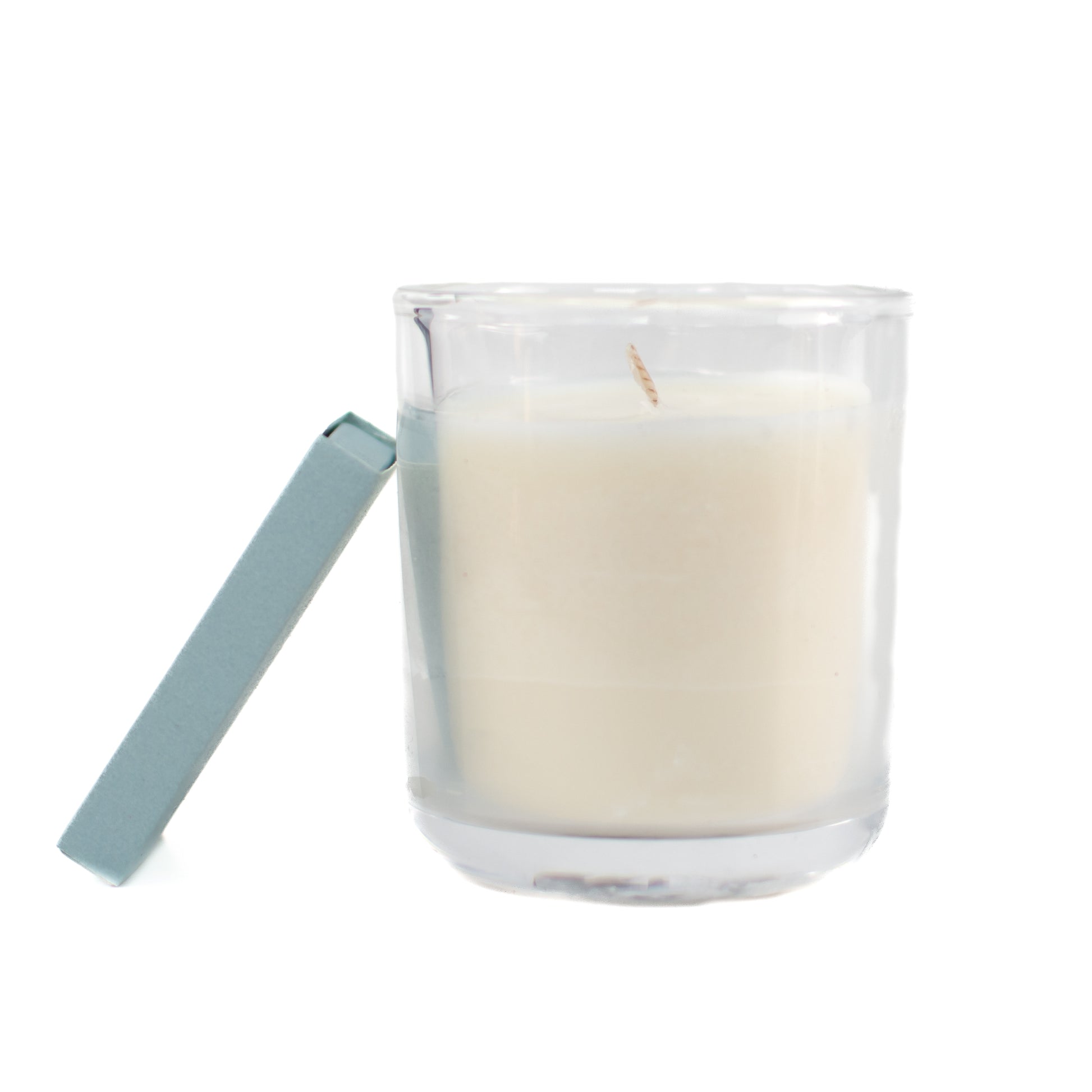The St. Paul fragrance free candle showing single wick, small clear glass jar, with matchbox