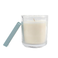 The St. Paul fragrance free candle showing single wick, small clear glass jar, with matchbox
