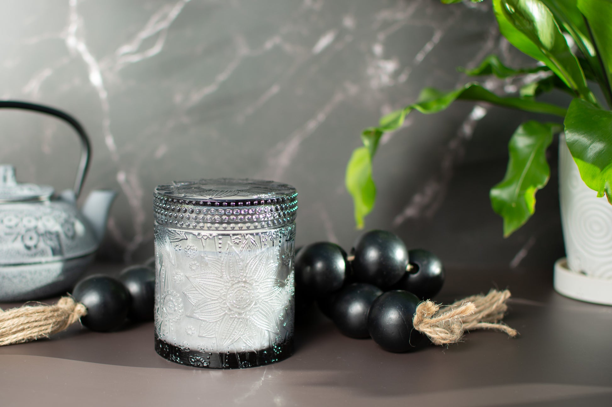 Sun shining on The Ubud fragrance free candle by Unscented Candle Company