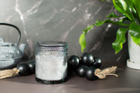 Sun shining on The Ubud fragrance free candle by Unscented Candle Company