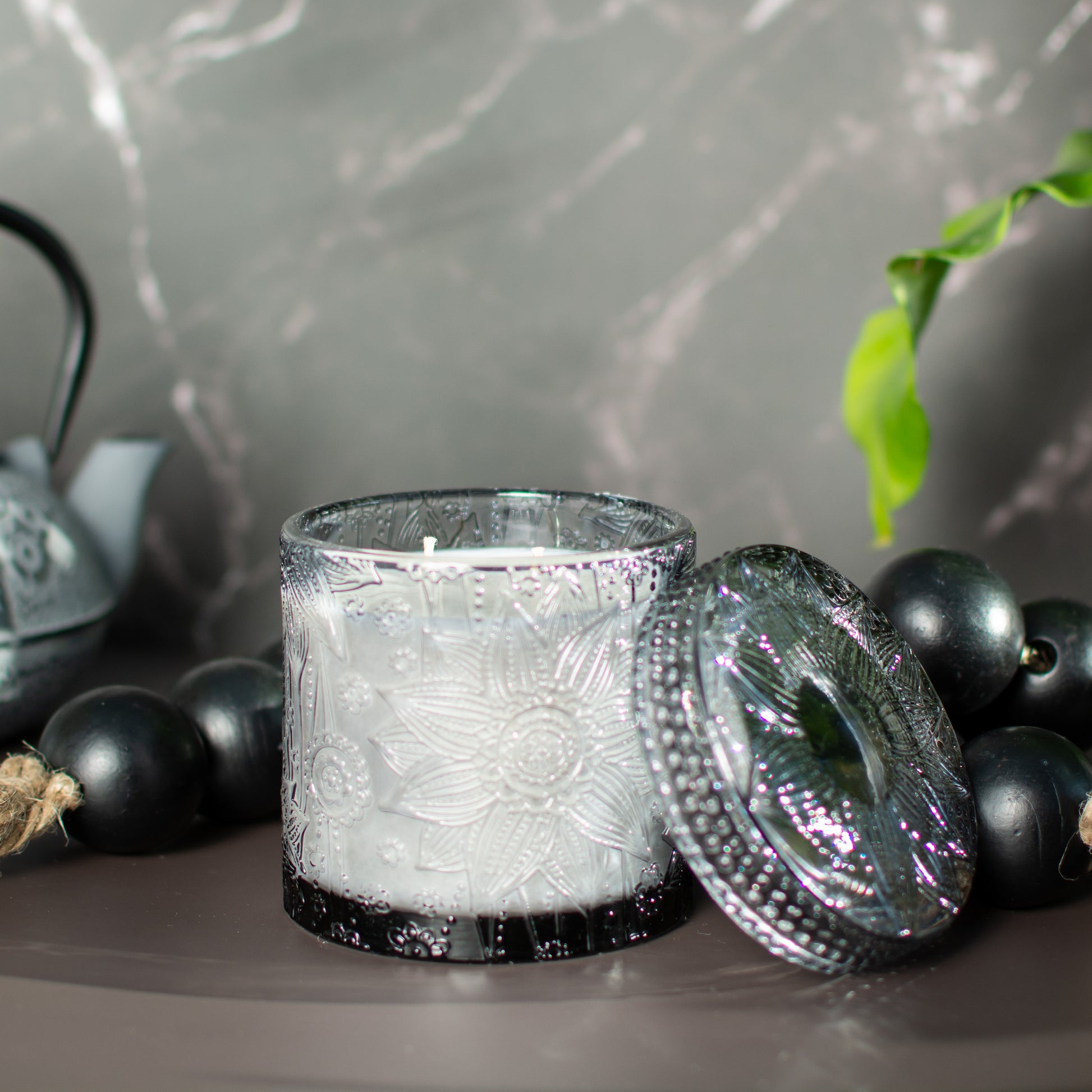 Close up of lotus inspired embossed detail, The Ubud candle by Unscented Candle Company