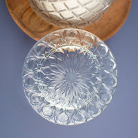 Close up of floral sunburst glass lid, The Vienna soy candle by Unscented Candle Company