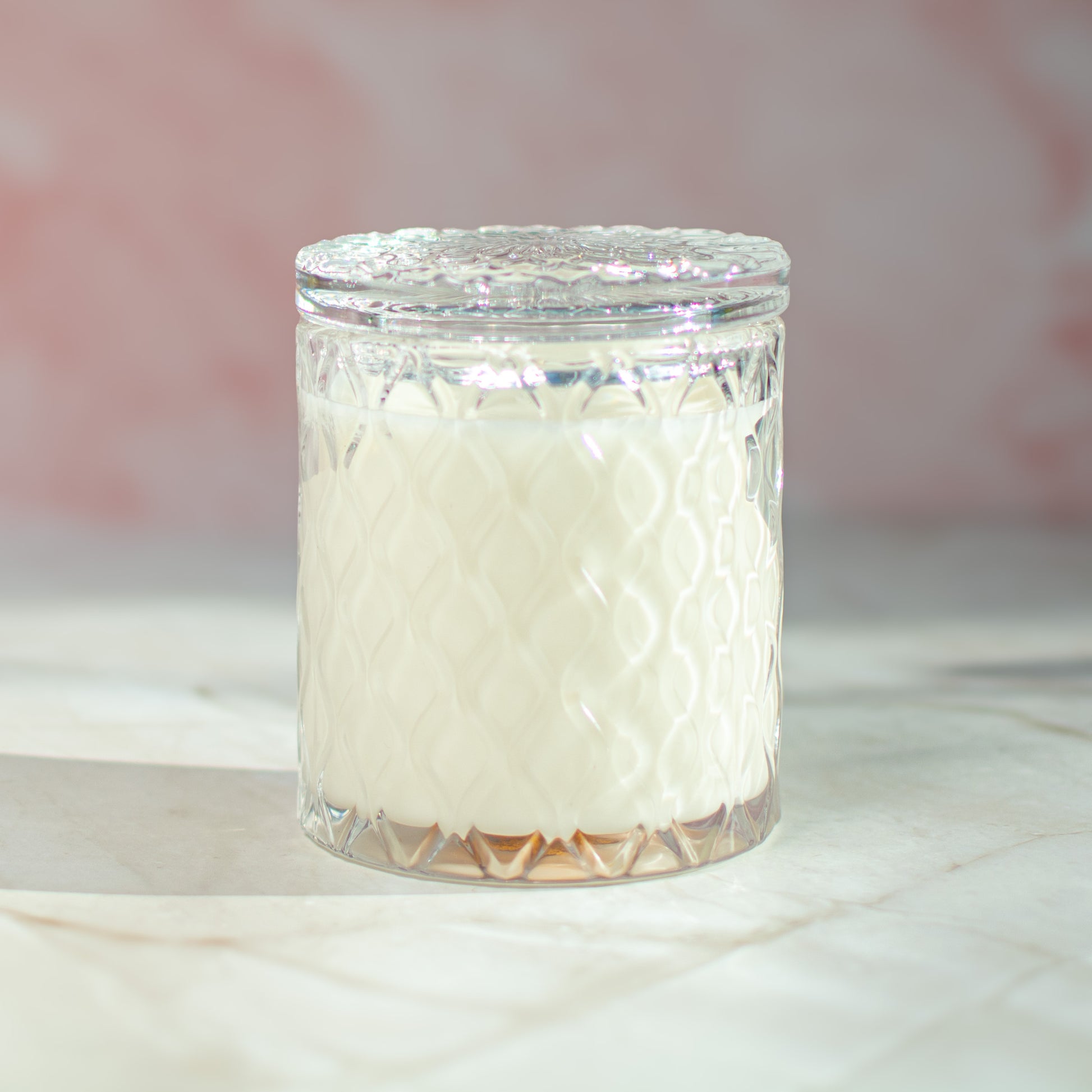 The Vienna soy candle by Unscented Candle Company on marble surface